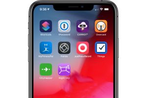 The image shows a screenshot of an iPhone with several apps installed, including Shortcuts, 1Password, CARROT⁵, Overcast, MyFitnessPal, Halide, Just Press Record, Things, Citymapper, and Night Sky. The user can download these apps without the App Store.