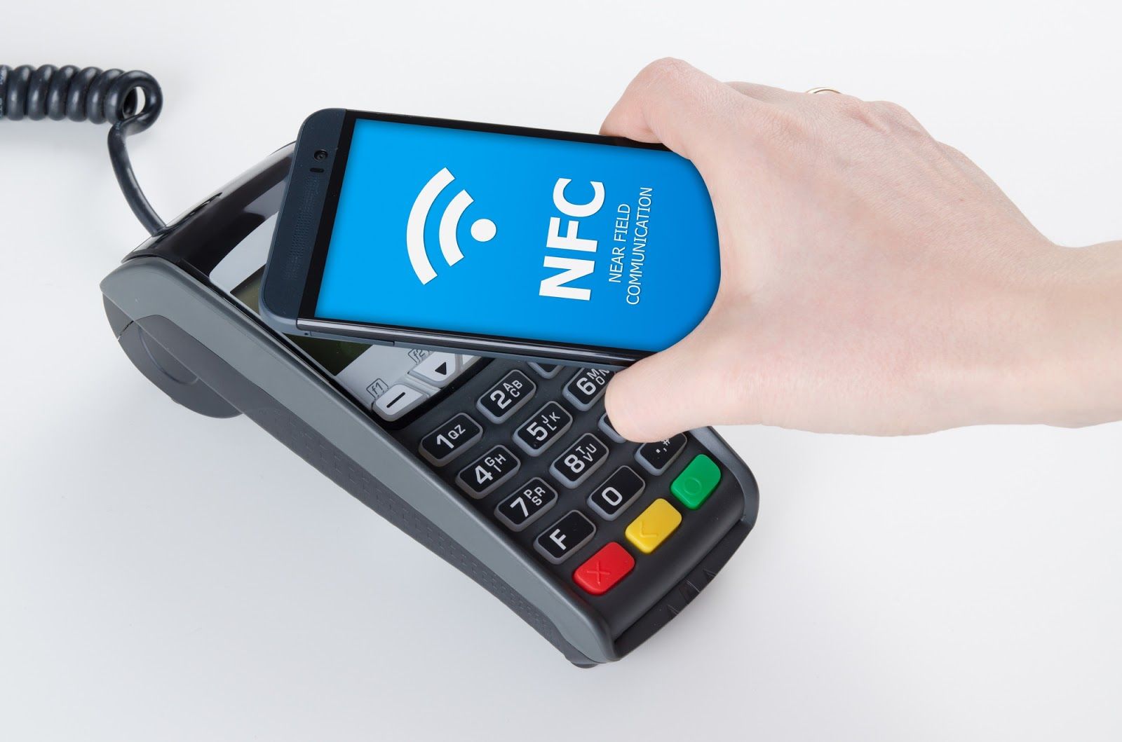 A smartphone with NFC features is shown being used to make a payment at a point-of-sale terminal.